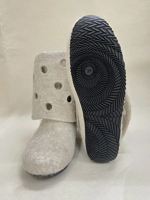Grey felt ankle boots with perforated, foldable collar and black rubber sole. Handmade in Finland from 100 % wool.
