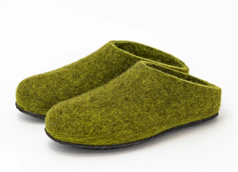 Moss green Lahtiset slip-ons with durable black rubber sole.