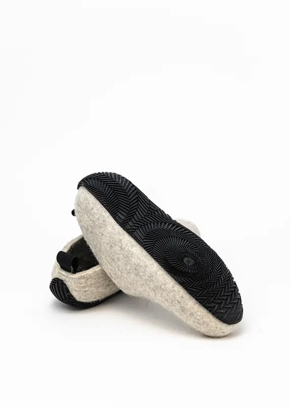 Grey wool-felt shoes with a black rubber sole and small heel loop, sole pattern visible.