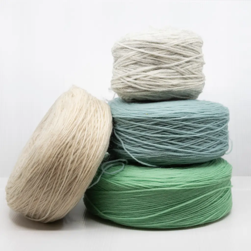Roving yarn balls in different colours – beige, light grey, aqua blue and mint green